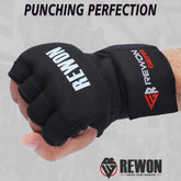 Black Rewon hand wraps for boxing, shown on a hand in a fist position. Ideal for boxing gloves and MMA, featuring breathable gel material.